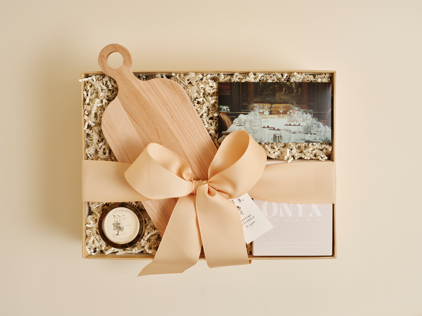 Luxury housewarming gift box with candle, coffee, and chocolate