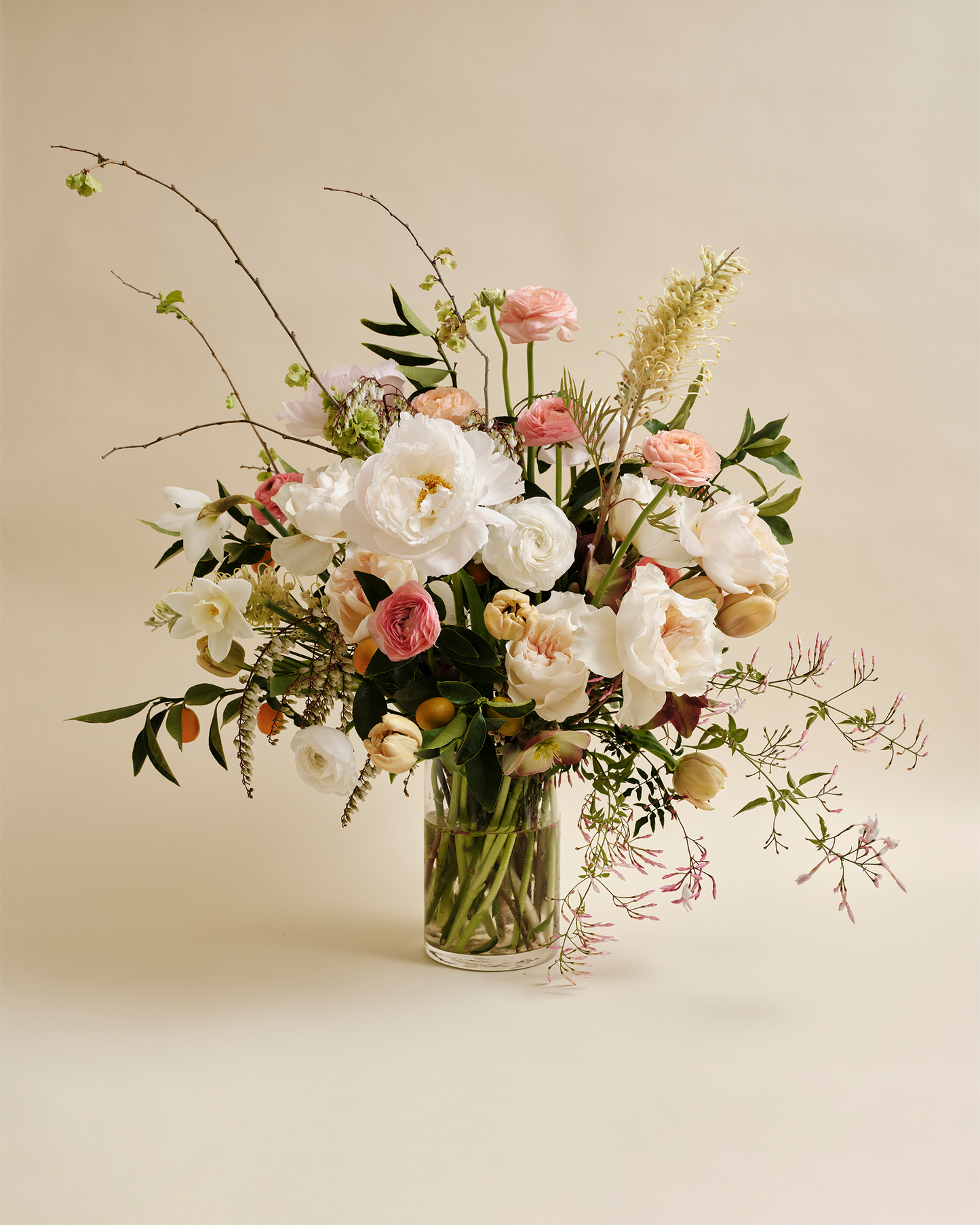 Luxe flower arrangement with seasonal blooms in glass vase