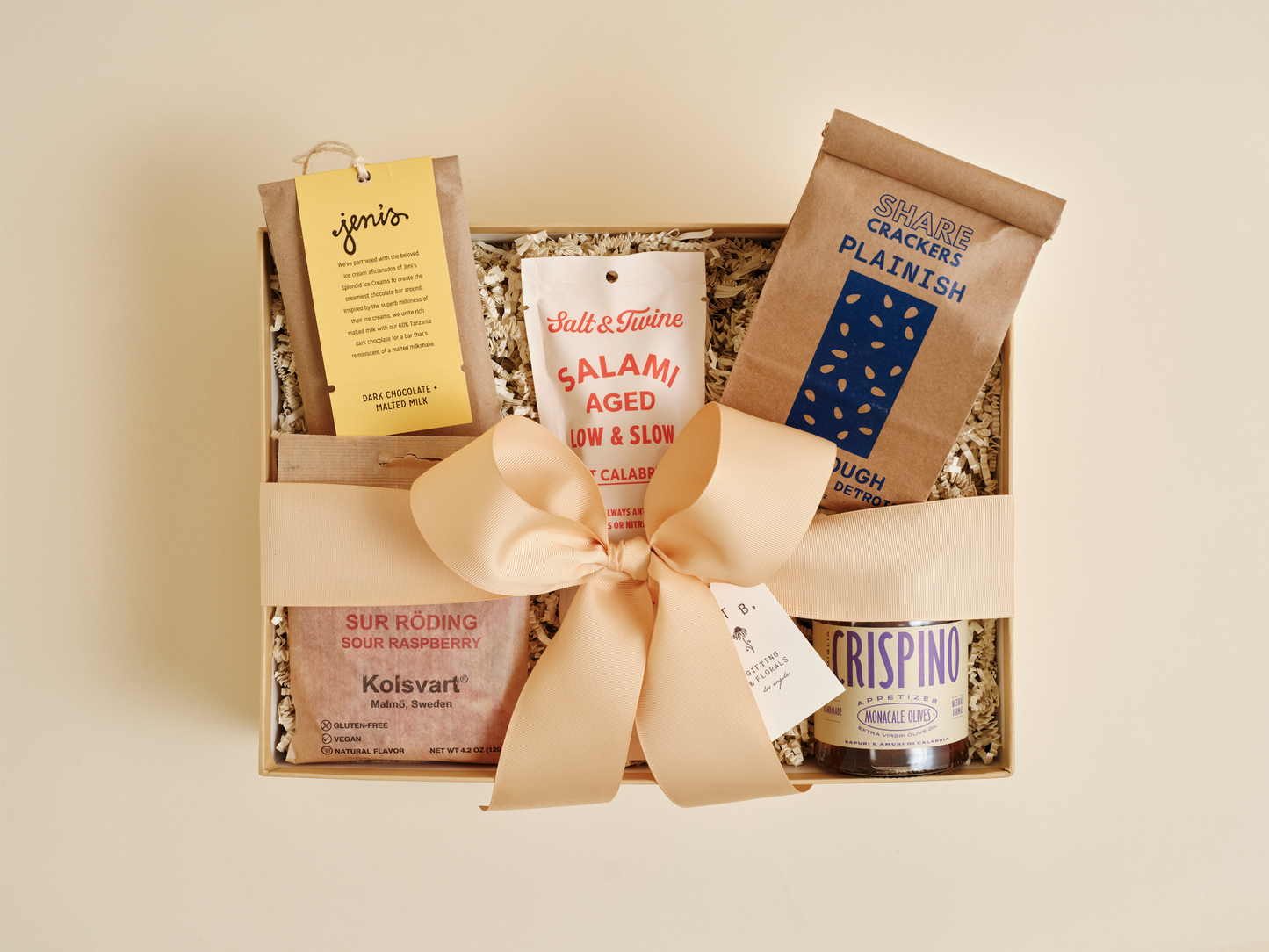 Gourmet snack gift box with crackers, chocolate, and specialty foods