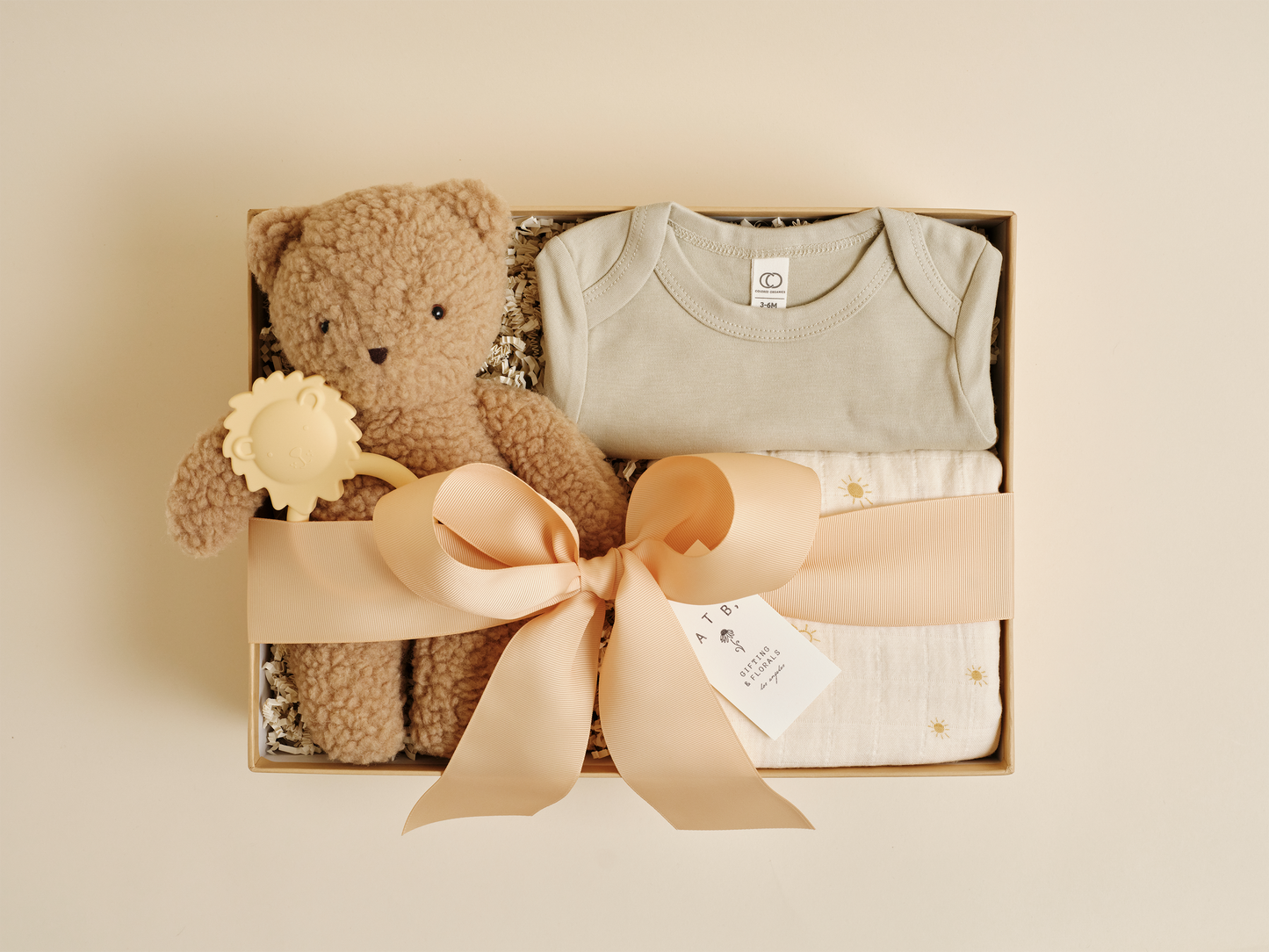 Welcome baby gift box with baby blanket, toy, and keepsake items