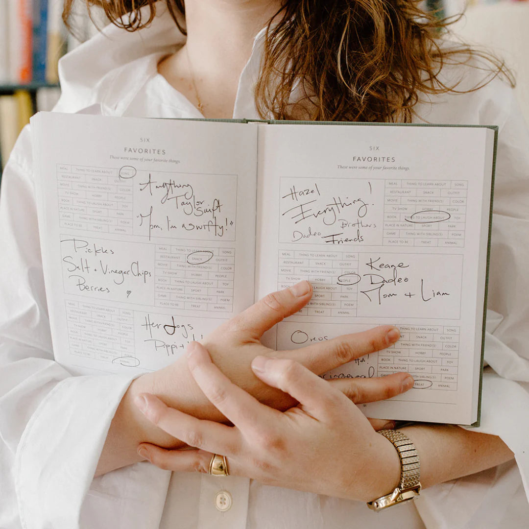 Woman holding childhood journal.