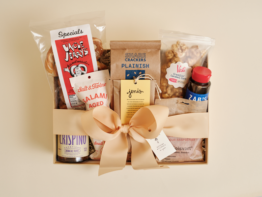 Gourmet snack gift box with crackers, chocolate, and specialty foods