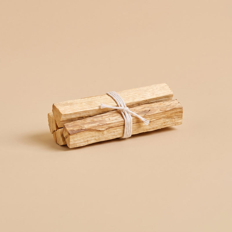 Bundle of palo santo wood sticks tied with cotton string